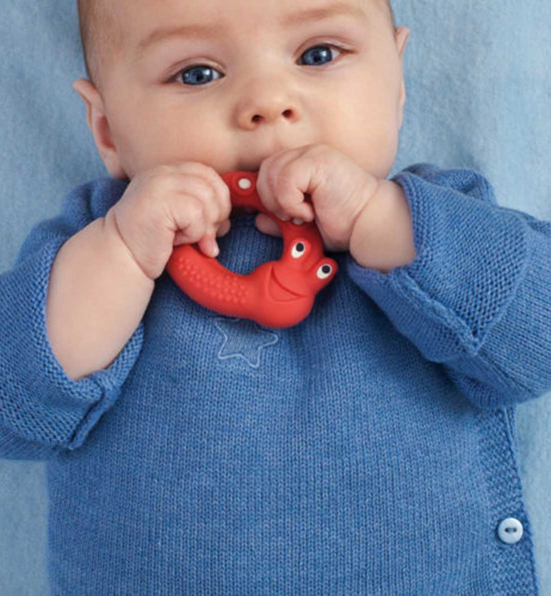 Baby with Red MAM Baby Teether