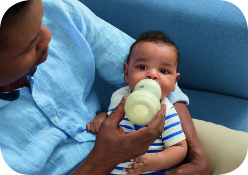 Dad feeding his son with a MAM Anti-Colic Bottle