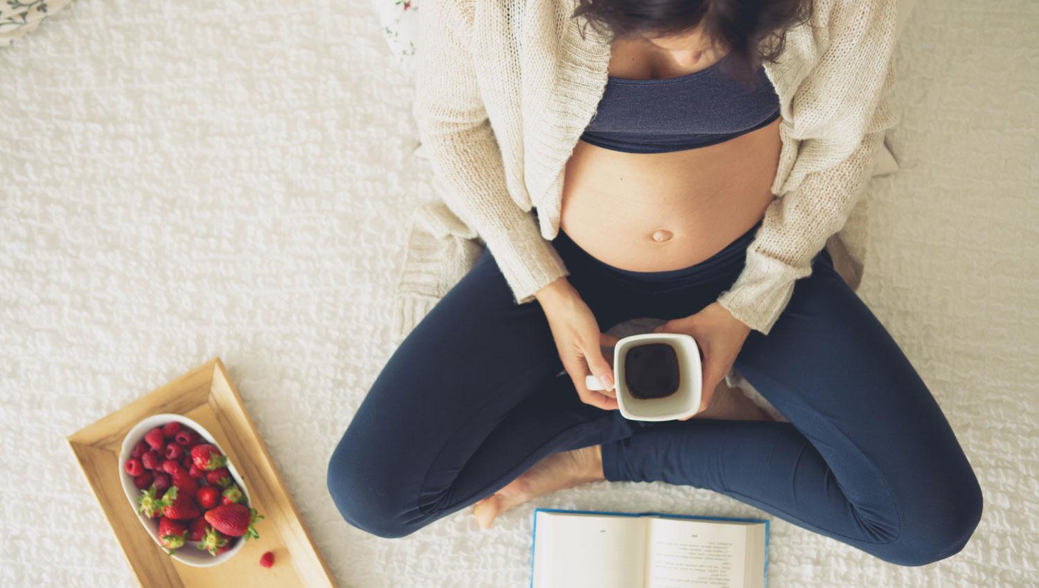 Pregnant lady with coffee