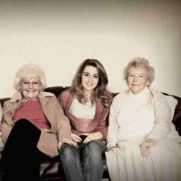 Family photo of young woman and two older ladies