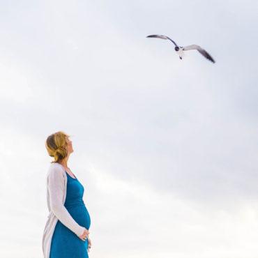 Pregnant lady watching seagull