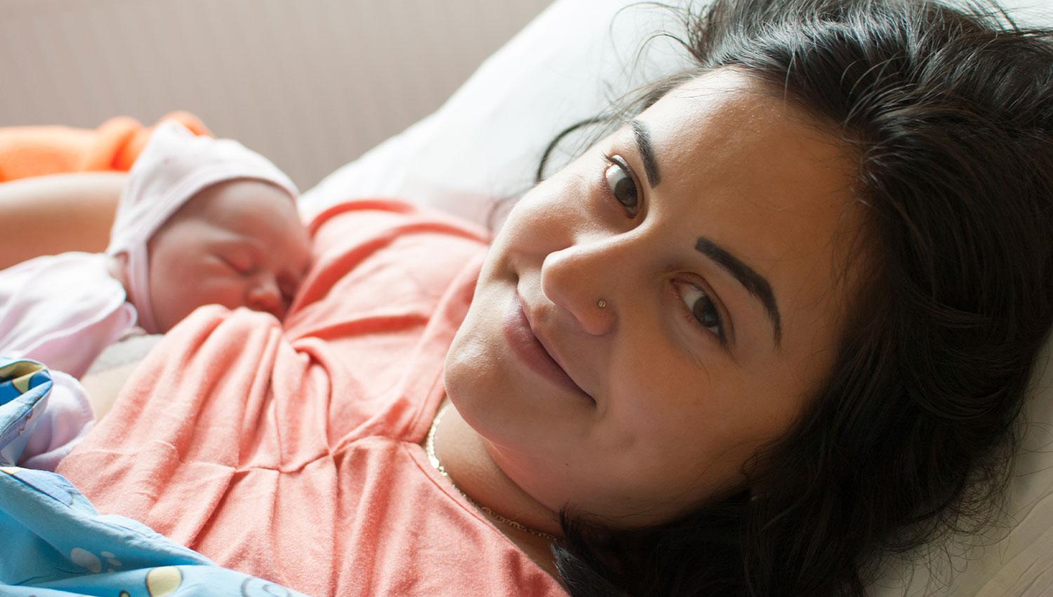 breastfeeding mother and newborn