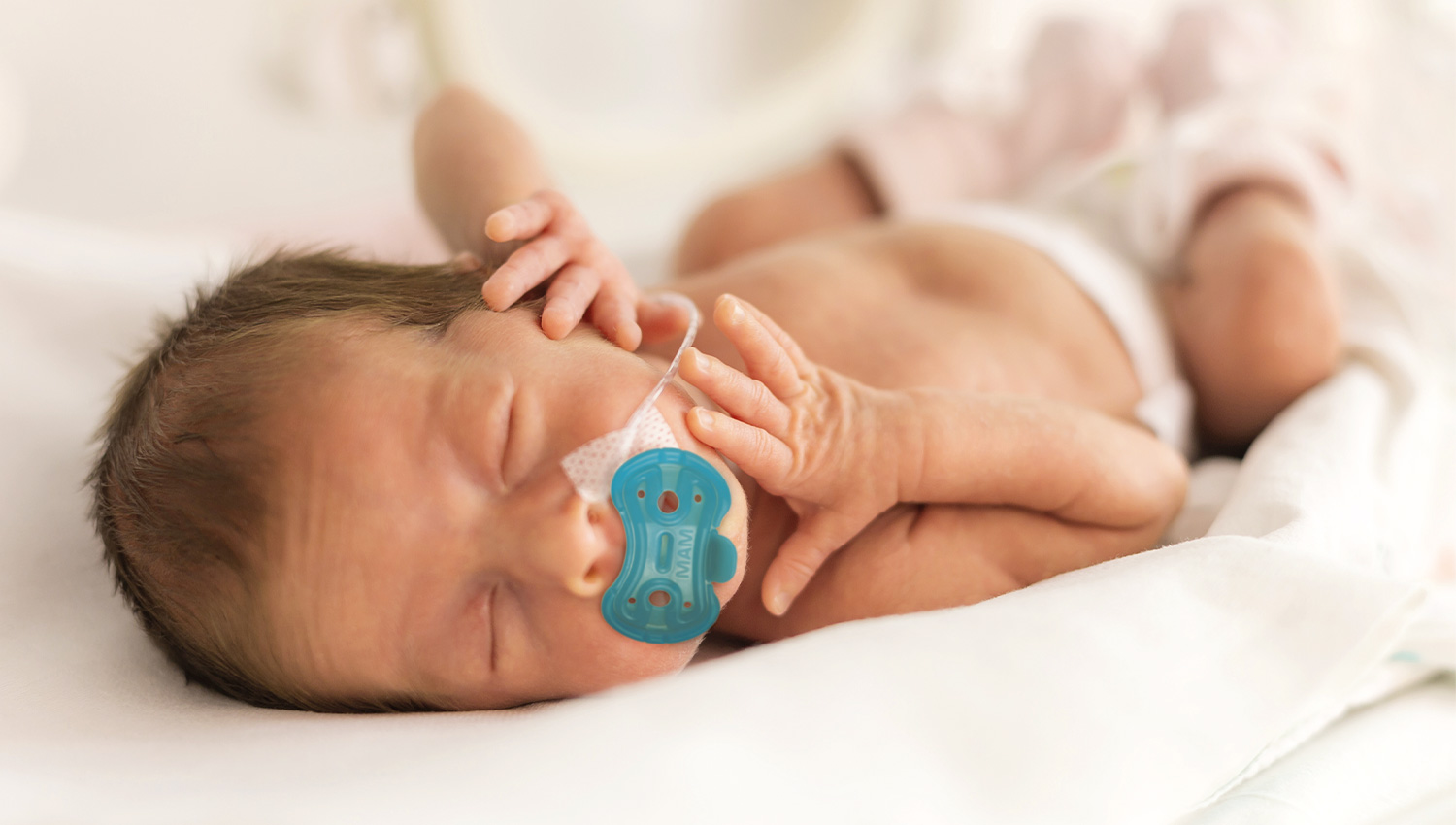 Premature baby with soother